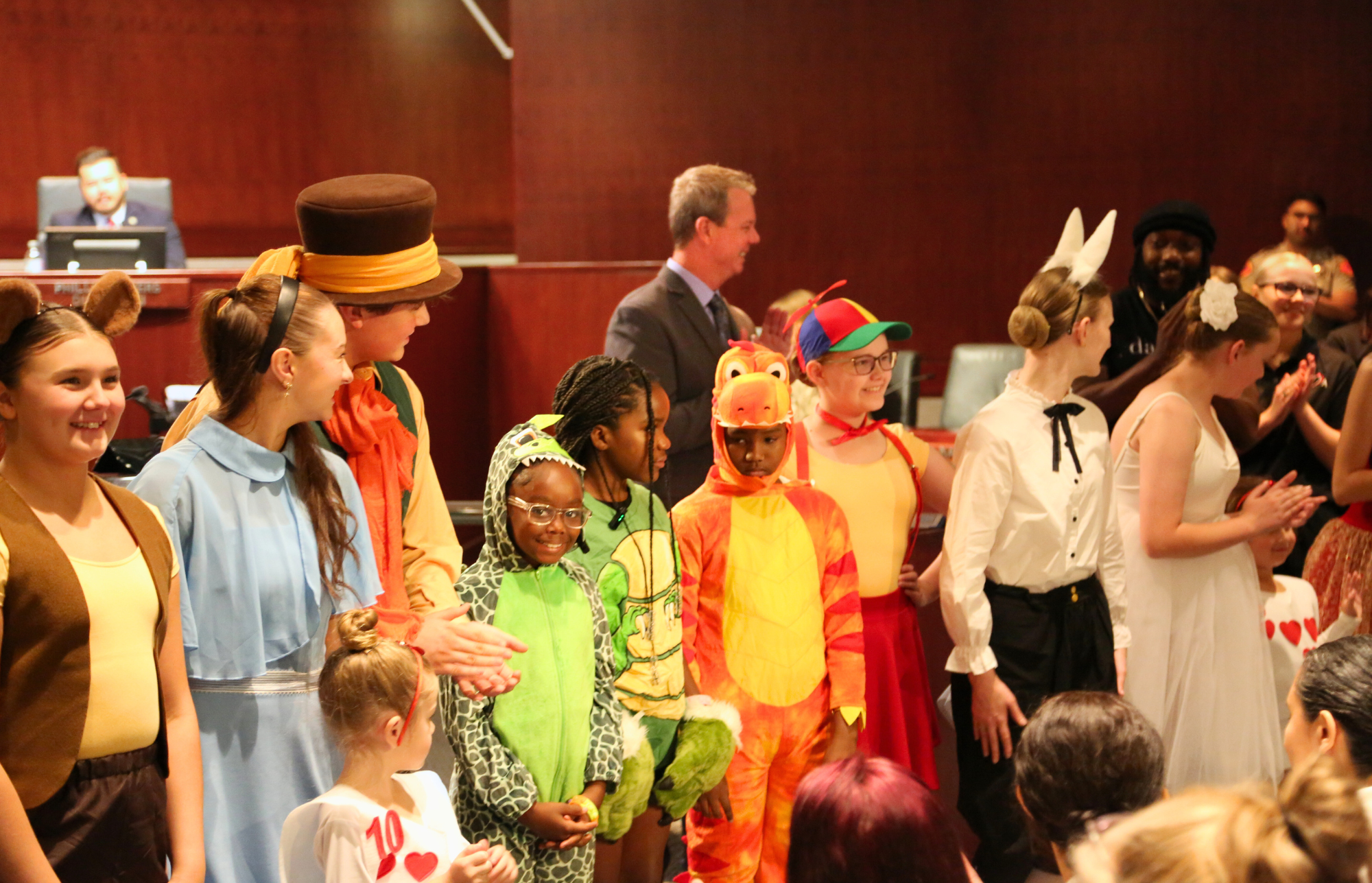 Dance students receiving a proclamation from the Board of Supervisors designating July as Books in Motion Month