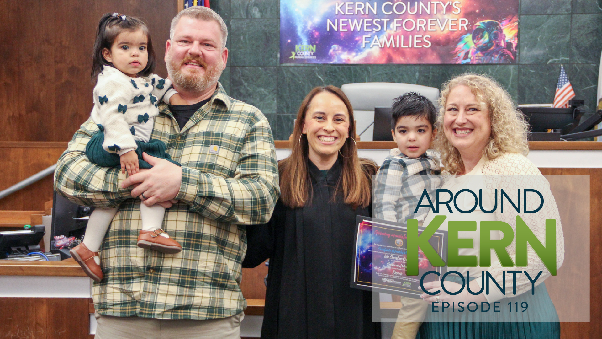 National Adoption Day family with their children and a judge